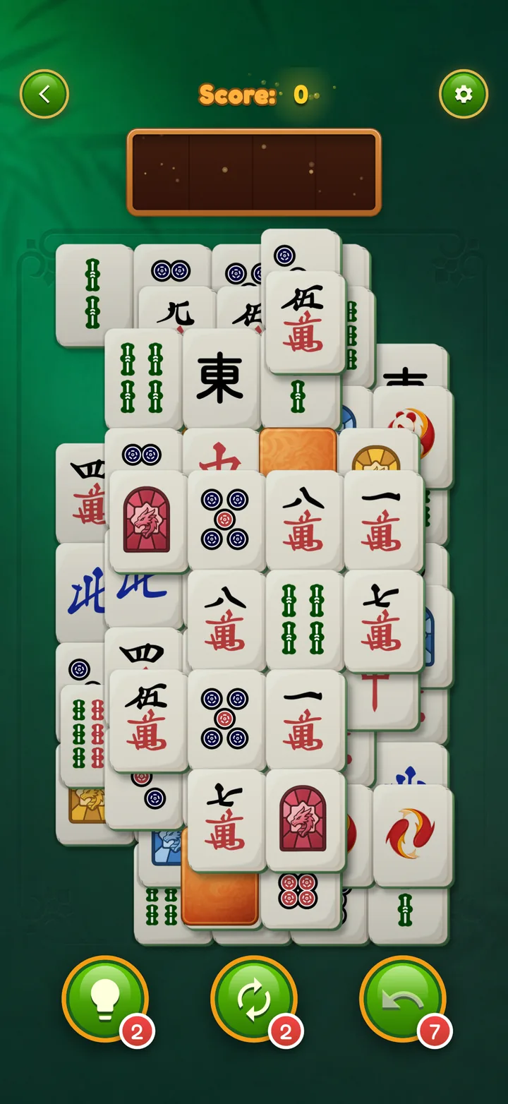 Mahjong Elite on iPhone: A level with the hint, shuffle and undo buttons and their counts below the board