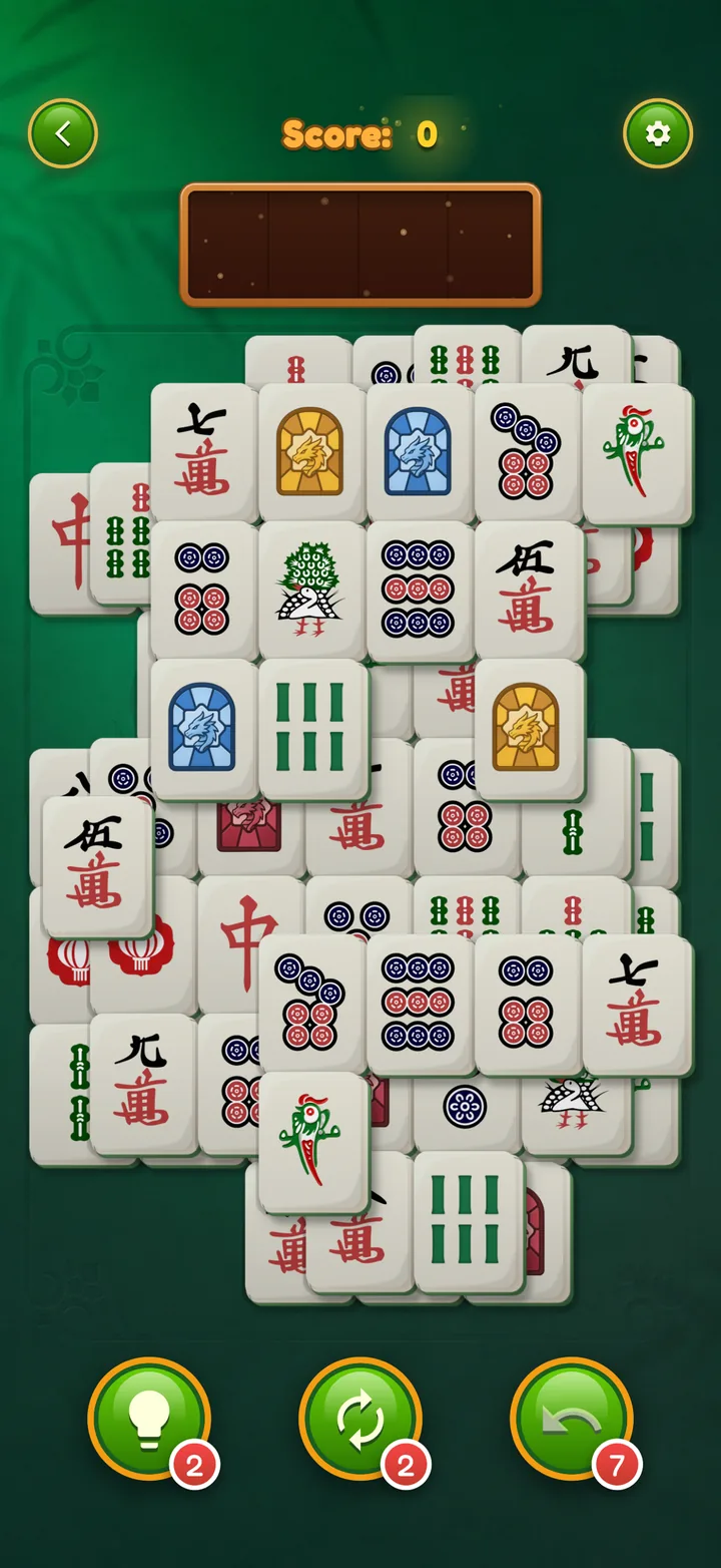 Mahjong Elite on iPhone: A layered level on green felt, ready to play